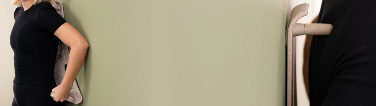 Person using the Reliefboard against a sage wall